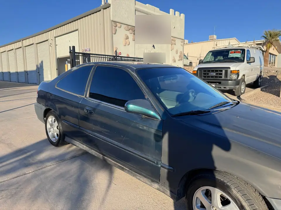 1997 Honda Civic window tint: Removed OLD OLD OLD tint off of 5 windows & the sunroof, Replaced with 5% all sides, rear & sunroof including a 3% (view 3)