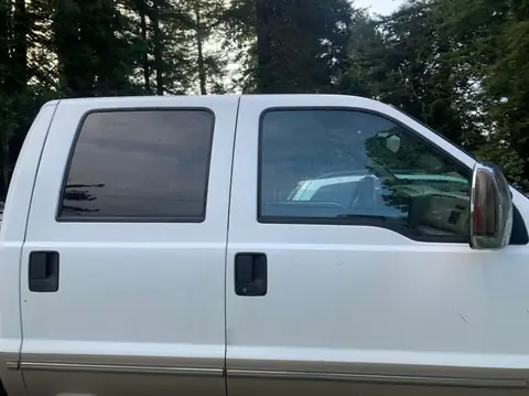 1999 Ford F-350 window tint: 5% all around, 5% medium visor (view 2)