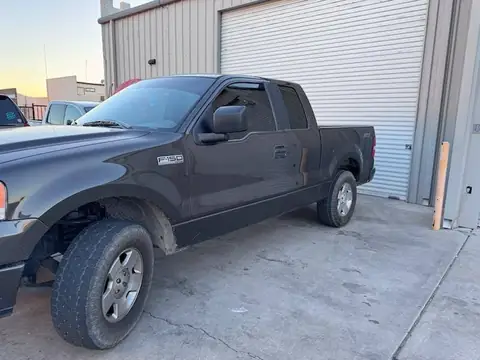 2000 Ford F-150 window tint: Removal of purple faded tint on rear 3 windows, New 5% Carbon rear 3 windows, 20% front doors, 3% windshield strip (view 2)