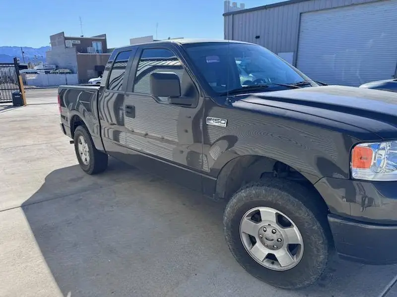 2000 Ford F-150 window tint: Removal of purple faded tint on rear 3 windows, New 5% Carbon rear 3 windows, 20% front doors, 3% windshield strip (view 3)