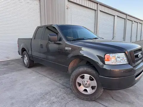 2000 Ford F-150 window tint: Removal of purple faded tint on rear 3 windows, New 5% Carbon rear 3 windows, 20% front doors, 3% windshield strip (view 4)