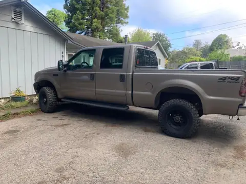 2002 Ford F-350 window tint: 5% on all the windows, 10.5 in visor strip in 5%