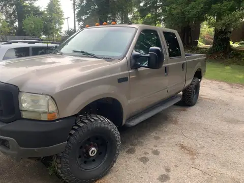 2002 Ford F-350 window tint: 5% on all the windows, 10.5 in visor strip in 5% (view 2)