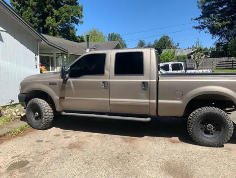 2002 Ford F-350 window tint: 5% on all the windows, 10.5 in visor strip in 5% (view 3)