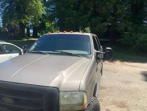2002 Ford F-350 window tint: 5% on all the windows, 10.5 in visor strip in 5% (view 4)