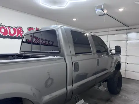 2002 Ford F-350 window tint: Removed old tint from front and rear doors, New 5% Ceramic rear doors and rear 3piece window, 15% Ceramic front doors