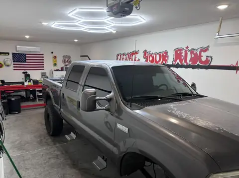 2002 Ford F-350 window tint: Removed old tint from front and rear doors, New 5% Ceramic rear doors and rear 3piece window, 15% Ceramic front doors (view 2)