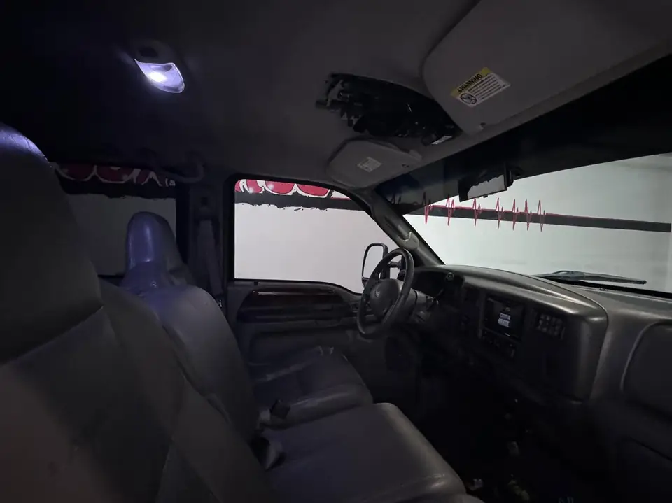 2002 Ford F-350 window tint: Removed old tint from front and rear doors, New 5% Ceramic rear doors and rear 3piece window, 15% Ceramic front doors (view 3)