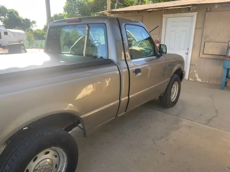 2003 Ford Ranger window tint: 15% supreme doors and rear windshield, 5% sun strip (view 3)