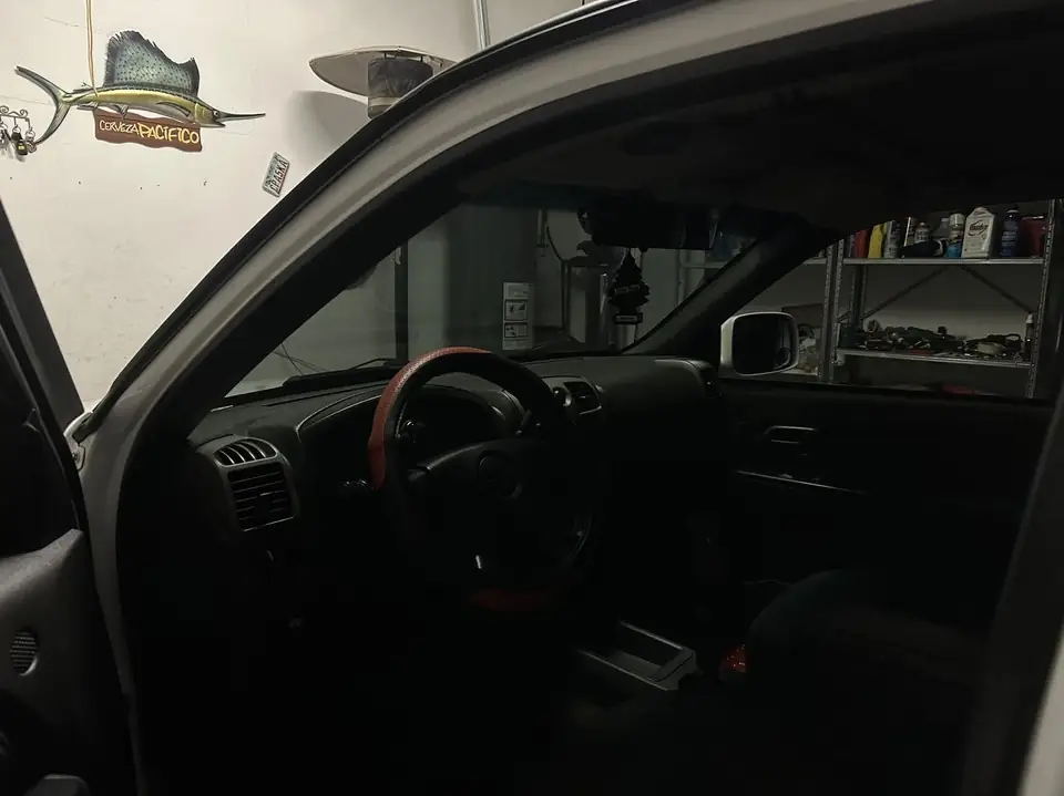 2004 Chevy Colorado window tint: Remove old faded tint from front doors, 20% nano ceramic front doors, 20% nano ceramic full front windshield (view 3)