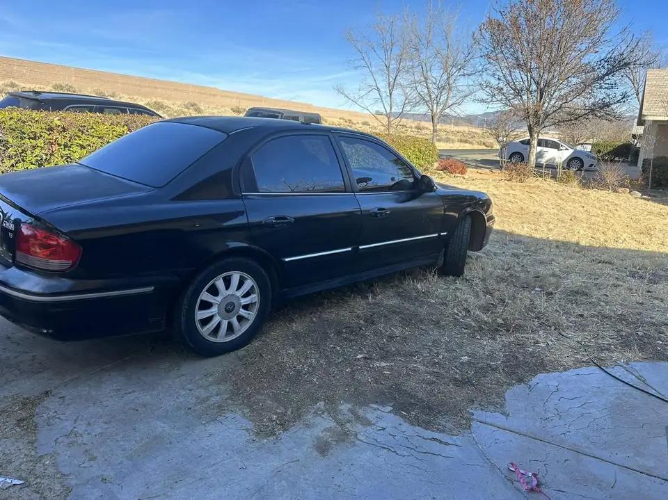 2004 Hyundai Sonata GLS window tint: Double 5% ceramic back glass, Double 20% rear doors, 20% ceramic front doors (view 2)