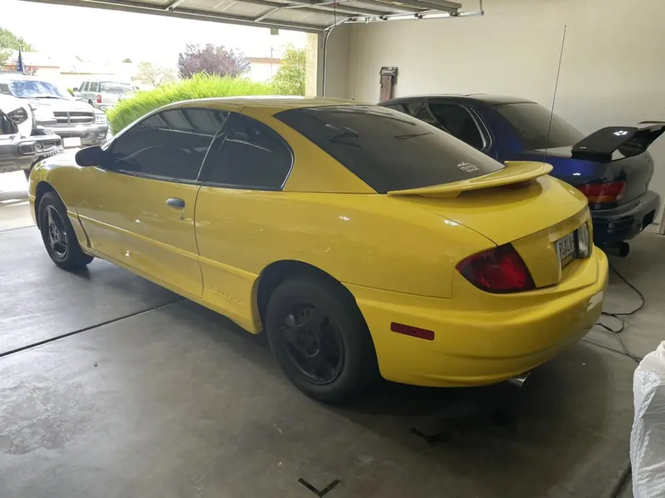 2004 Pontiac Sunfire window tint: 5% Premium Ceramic all windows (view 2)