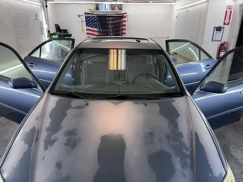 2004 Toyota Camry window tint: Wrapped up in our 15% C-IR on sides and rear window and a 5% Sunstrip before they get a full color change wrap done