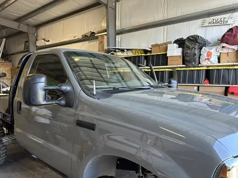 2005 Ford F-250 window tint: Old tint removed, 5% rear window, 20% side windows, 40% full windshield, 5% windshield strip (view 2)