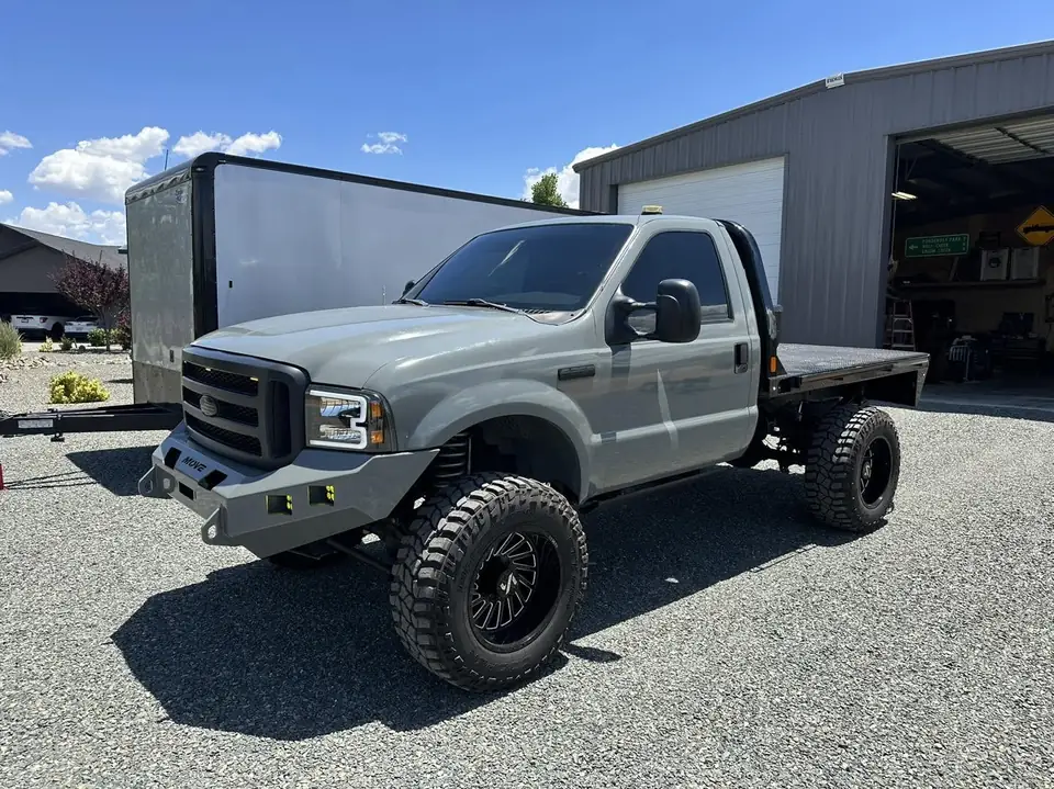 2005 Ford F-250 window tint: Old tint removed, 5% rear window, 20% side windows, 40% full windshield, 5% windshield strip (view 4)