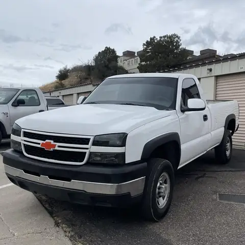 2006 Chevy 1500 single cab window tint: Old peeling faded tint removed, Premium double 5% rear window, Premium 25% sides, 5% upper and lower strips