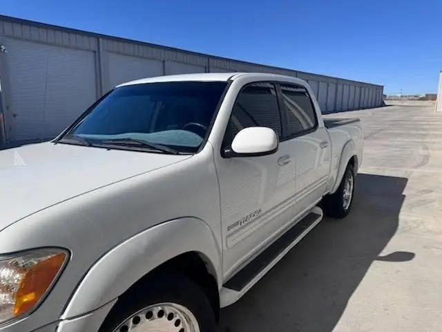 2006 Toyota Tundra window tint: Installed 35% Carbon on front 2 door windows and a 3% windshield visor strip (view 2)
