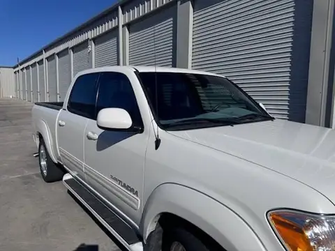 2006 Toyota Tundra window tint: Installed 35% Carbon on front 2 door windows and a 3% windshield visor strip (view 3)