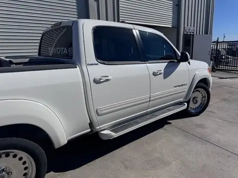 2006 Toyota Tundra window tint: Installed 35% Carbon on front 2 door windows and a 3% windshield visor strip (view 4)