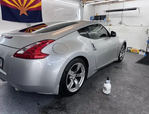 2009 Nissan 370Z window tint: Removed the faded tint from the rear hatch, Installed 15% on the rear hatch, 35% on the sides and a 5% sunstrip