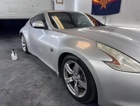 2009 Nissan 370Z window tint: Removed the faded tint from the rear hatch, Installed 15% on the rear hatch, 35% on the sides and a 5% sunstrip (view 2)