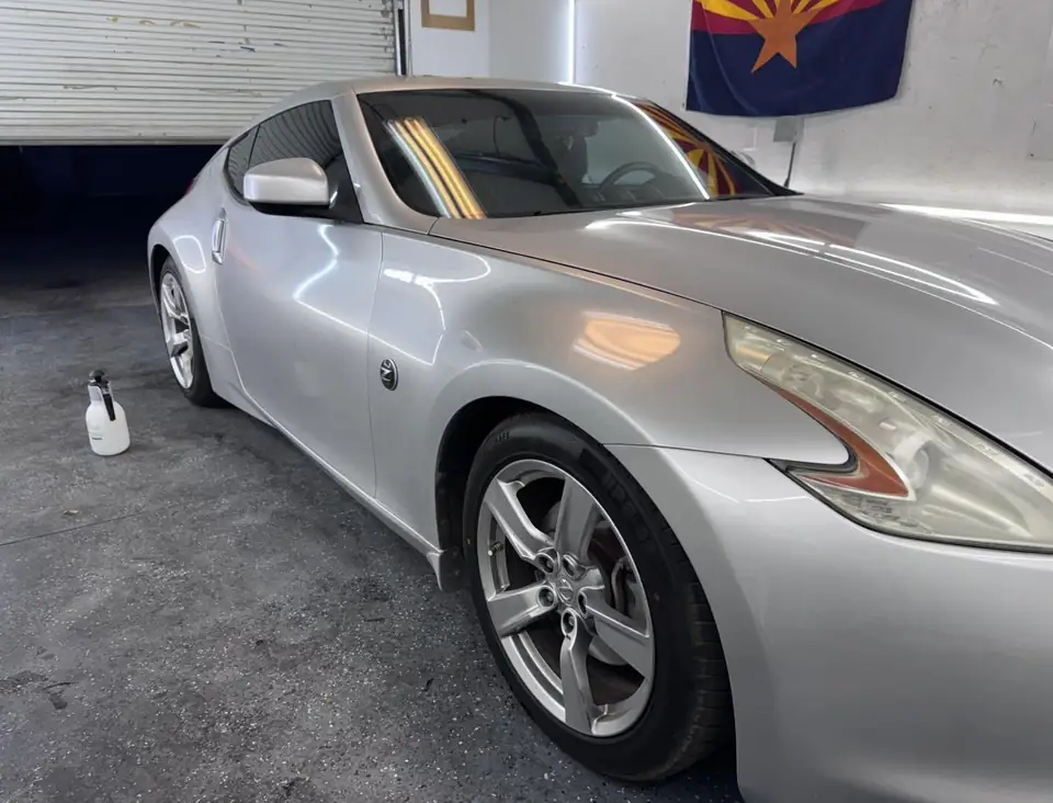 2009 Nissan 370Z window tint: Removed the faded tint from the rear hatch, Installed 15% on the rear hatch, 35% on the sides and a 5% sunstrip (view 2)