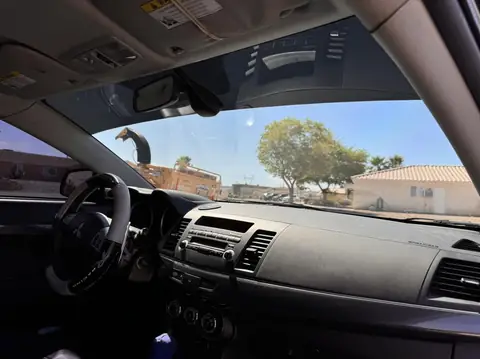 2010 Mitsubishi Lancer window tint: 50% Full windshield, 3% sunstrip and sunroof (view 2)