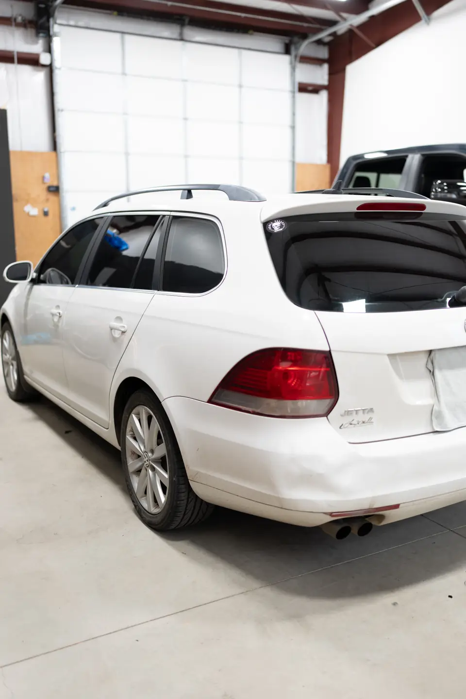 2010 Volkswagen Jetta SportWagen window tint: Old failing film removed, then retinted all around: 5% on the rear half, 20% on the front doors, and a full 35% windshield, done at the shop in Prescott Valley (view 12)