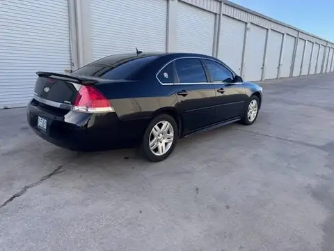 2011 Chevy Impala window tint: 5% Rear 3 Windows, Windshield Visor Strip, 35% Front Doors (view 2)