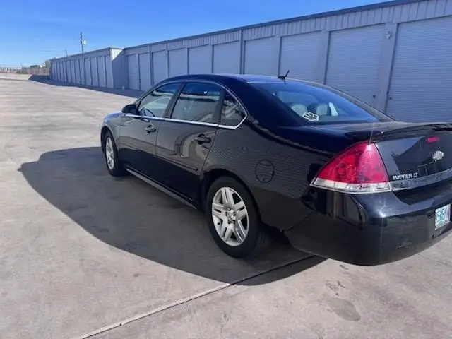2011 Chevy Impala window tint: 5% Rear 3 Windows, Windshield Visor Strip, 35% Front Doors (view 3)