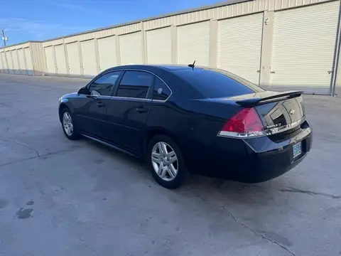 2011 Chevy Impala window tint: 5% Rear 3 Windows, Windshield Visor Strip, 35% Front Doors (view 4)