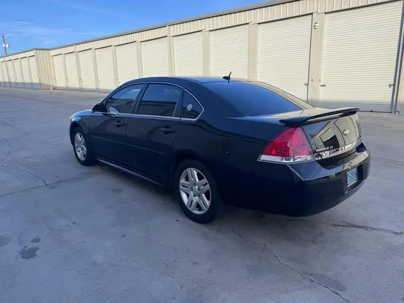 2011 Chevy Impala window tint: 5% Rear 3 Windows, Windshield Visor Strip, 35% Front Doors (view 4)