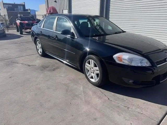 2011 Chevy Impala window tint: 5% Rear 3 Windows, Windshield Visor Strip, 35% Front Doors (view 5)