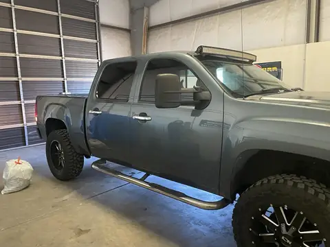 2011 GMC Sierra window tint: Old faded tint removed, 5% Standard on the rear doors and back glass, 15% Ceramic front doors