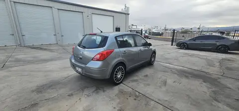 2011 Nissan Versa hatchback window tint: Installed 5% on rear half of the car, Installed 3% Windshield Visor Strip