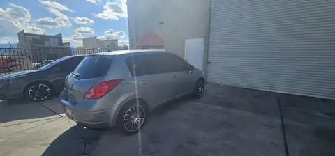 2011 Nissan Versa hatchback window tint: Installed 5% on rear half of the car, Installed 3% Windshield Visor Strip (view 2)