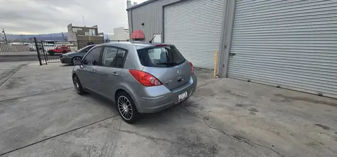 2011 Nissan Versa hatchback window tint: Installed 5% on rear half of the car, Installed 3% Windshield Visor Strip (view 3)