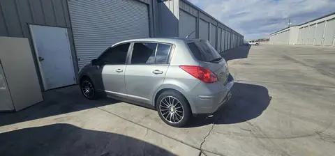 2011 Nissan Versa hatchback window tint: Installed 5% on rear half of the car, Installed 3% Windshield Visor Strip (view 4)