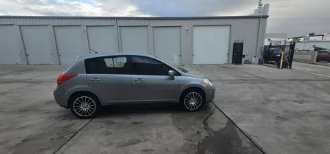 2011 Nissan Versa hatchback window tint: Installed 5% on rear half of the car, Installed 3% Windshield Visor Strip (view 5)