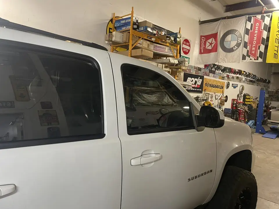 2012 Chevy Suburban window tint: 35% Premium Ceramic front doors (view 2)
