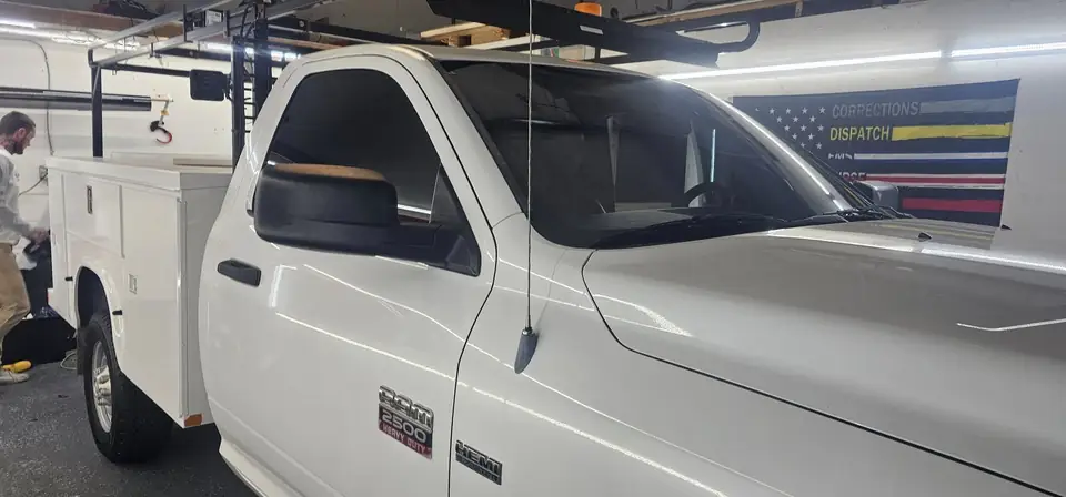 2012 Dodge Ram 2500 work truck window tint: Remove OLD tint from front door windows, Installed Limo on front 2 door windows, Installed 40% on (view 2)