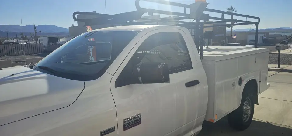2012 Dodge Ram 2500 work truck window tint: Remove OLD tint from front door windows, Installed Limo on front 2 door windows, Installed 40% on (view 3)