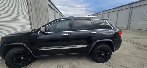 2012 Jeep Grand Cherokee window tint: 5% all sides with a 3% Windshield Visor Strip
