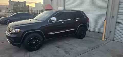 2012 Jeep Grand Cherokee window tint: 5% all sides with a 3% Windshield Visor Strip (view 2)