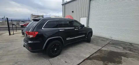 2012 Jeep Grand Cherokee window tint: 5% all sides with a 3% Windshield Visor Strip (view 3)