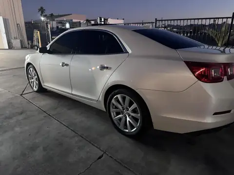 2014 Chevy Malibu and 2013 Chevy Silverado window tint: 2014 Chevy Malibu: full removal of old film, new 5% C-IR sides and rear window, 2013 Chevy (view 2)