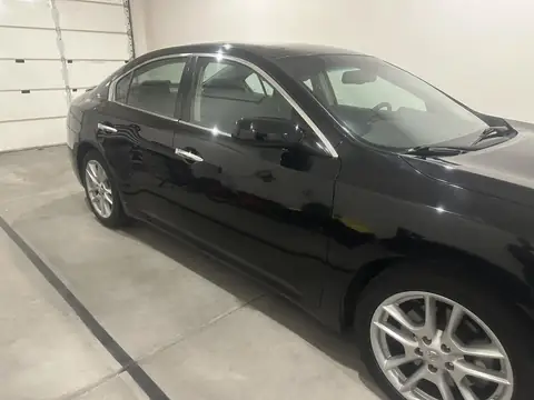 2014 Nissan Maxima window tint: Full protection ceramic package, 5% rear 3 windows, 15% front 2 windows, 70% full windshield, 5% windshield strip