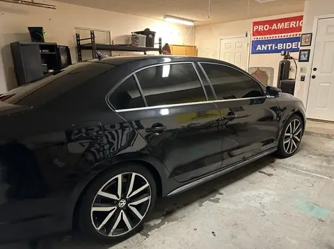 2014 VW Jetta GLI window tint: Strip all faded bubbly tint, 5% Nano Carbon 4 doors and back glass, 50% Nano Ceramic full windshield, 5% Windshield (view 2)