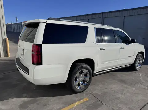 2015 Chevy Suburban window tint: 15% Over the rear half privacy windows (1% read), 5% front doors and sunstrip (view 2)
