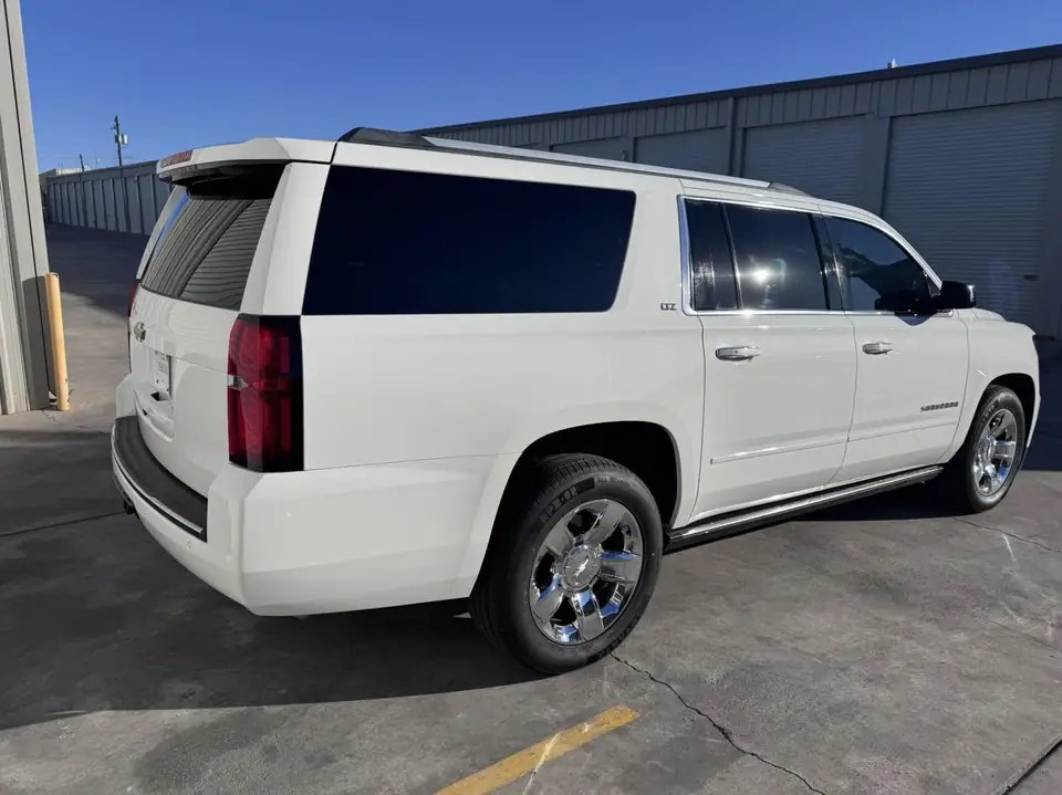 2015 Chevy Suburban window tint: 15% Over the rear half privacy windows (1% read), 5% front doors and sunstrip (view 2)